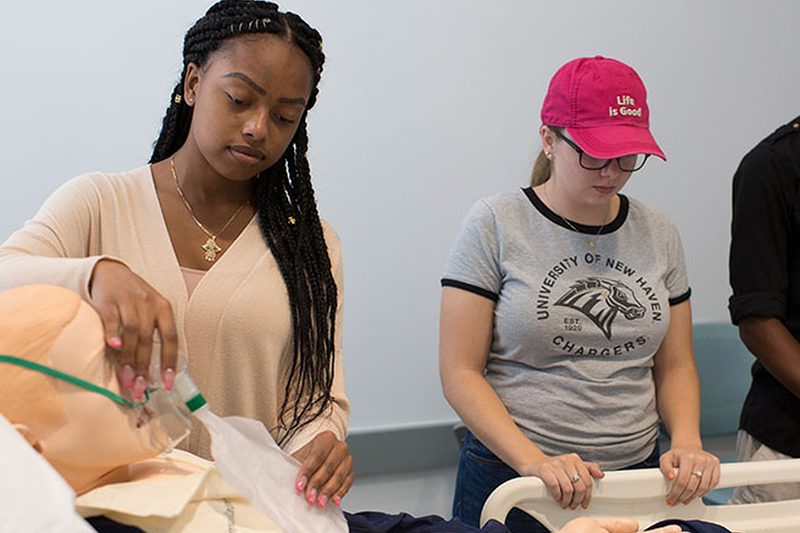 A Student examining mock crime scene evidence.