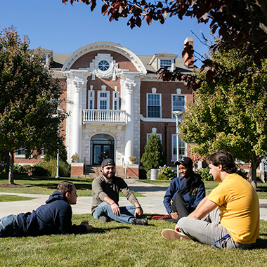 Students sitting in Maxcy quad