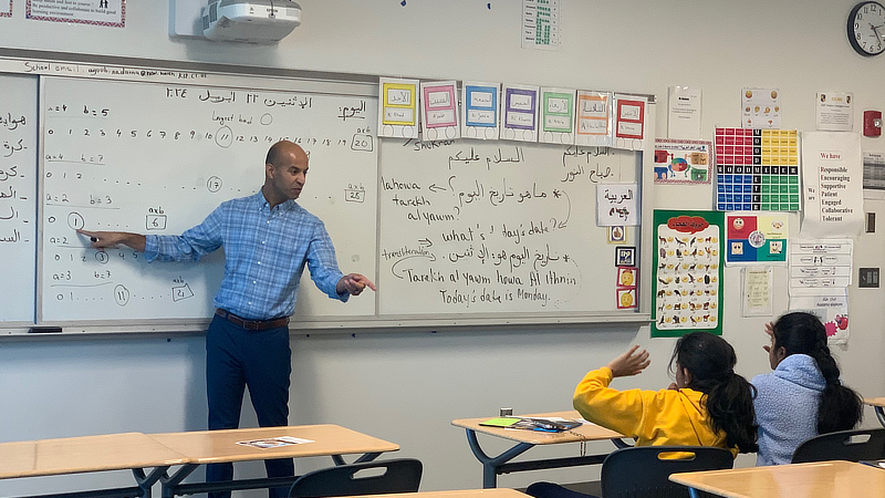 Dr. Houssein El Turkey teaches a class to middle school students.