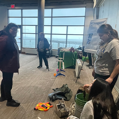 Three students talking with each other.