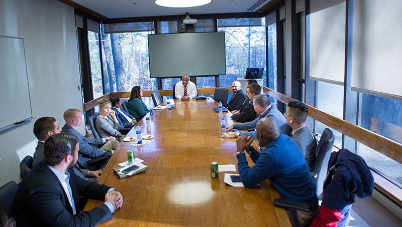 Image of Ferdinand L. Risco, Jr. speaking to students.