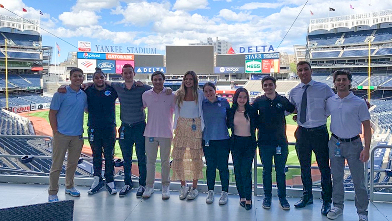 Alphonse Lustrino ’23 (left) participated in the Yankees Summer Sales program.