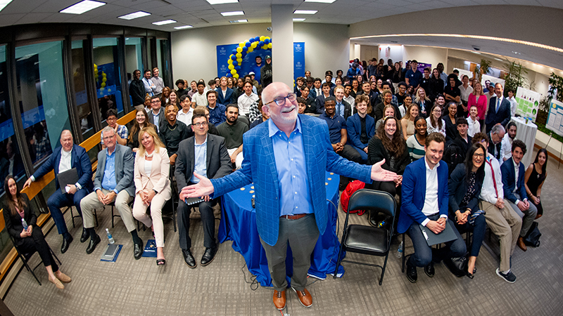 Brian Marks, J.D., Ph.D., (front, center) with attendees at the competition.