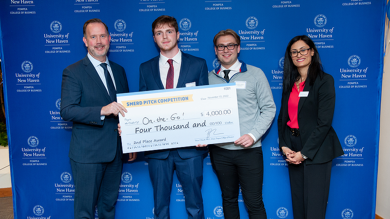 Dean Brian Kench and Dr. Vasiliki Kosmidou with students