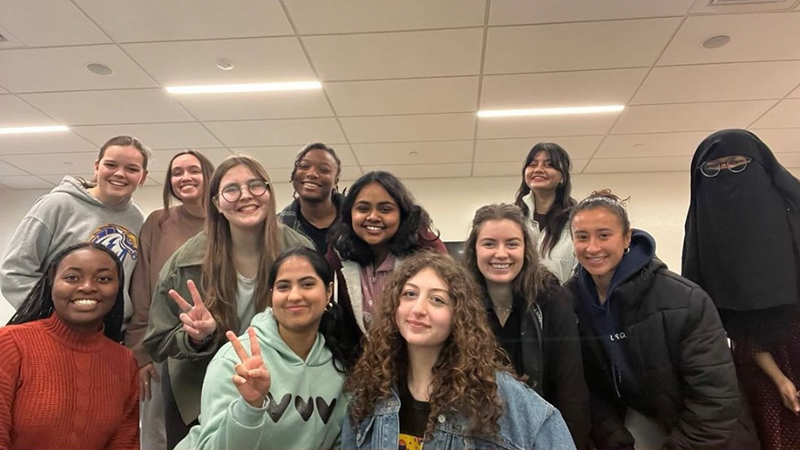 Kate Fedirko ’25 (fourth from left) is a proud member of the University’s Women in Business Club.