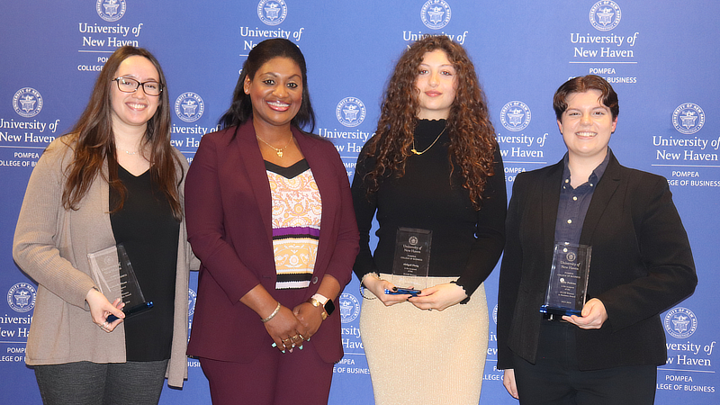 Dr. Candice Deal and students at the ceremony.