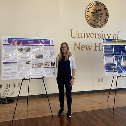 Kristine Horvat, Ph.D., with her poster.