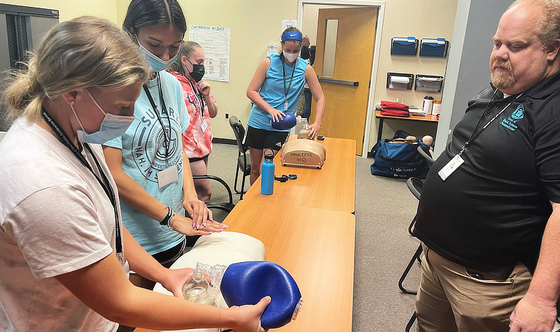 Students learning CPR