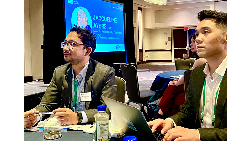 Pradeep Rajbhandari ’23 MPH (left) and Dr. Alvin Tran at a conference