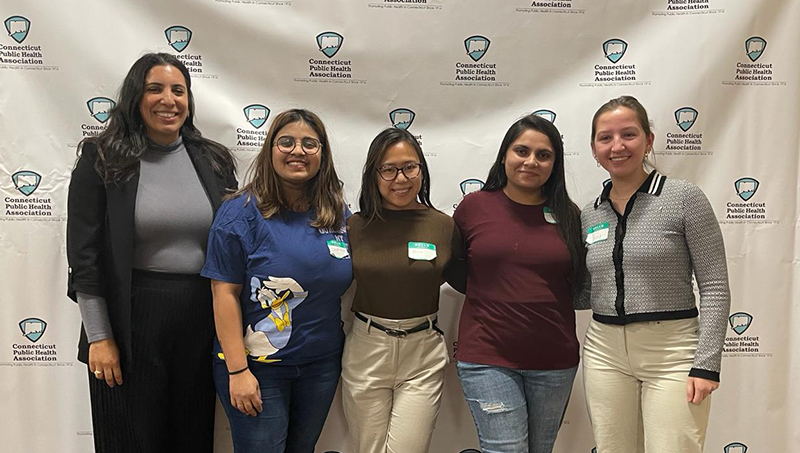 Five students in the University’s School of Health Sciences pose for a photo side by side.