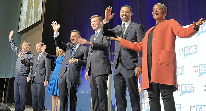 Erick Russell ’09 (second from right) and several of Connecticut’s democratic leaders and lawmakers. .