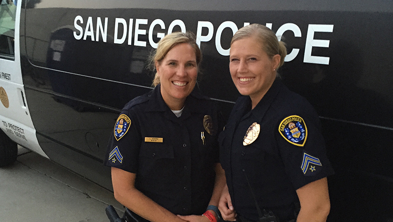 Lori Adams ’24 M.S. (left) with another female officer.