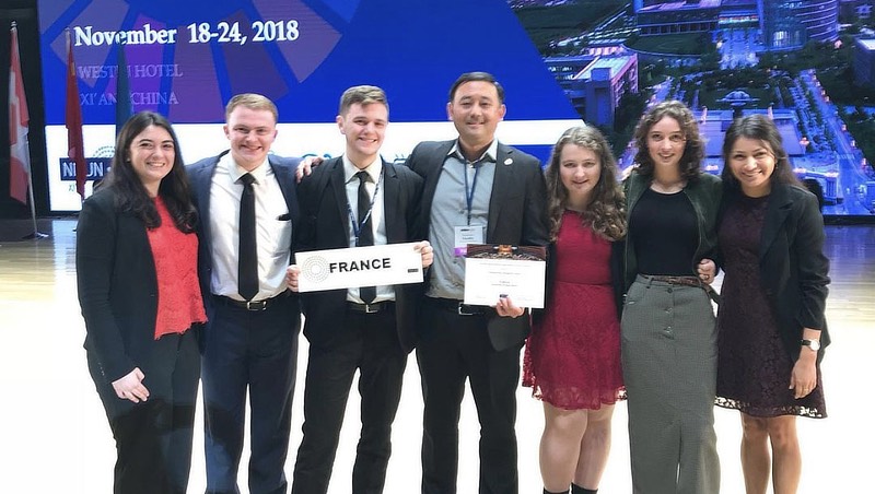 Image of Doug and  Dr. Haynes with other studentes at Model UN event.