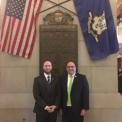 Ryan Noonan ’20, ’23 M.S. (left) as an intern at the Connecticut General Assembly with Pat Boyd.