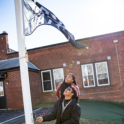 Raising the “Black Lives Matter” flag on campus.