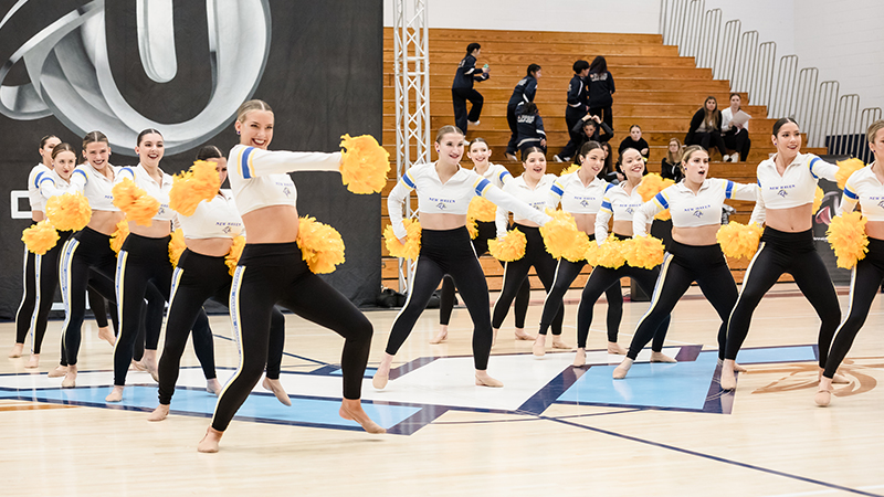 The team performing their pom routine.