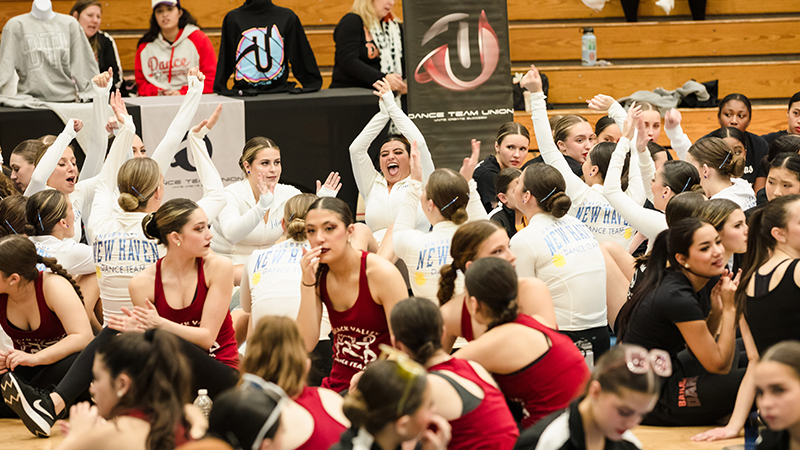 The team celebrates during an awards ceremony.