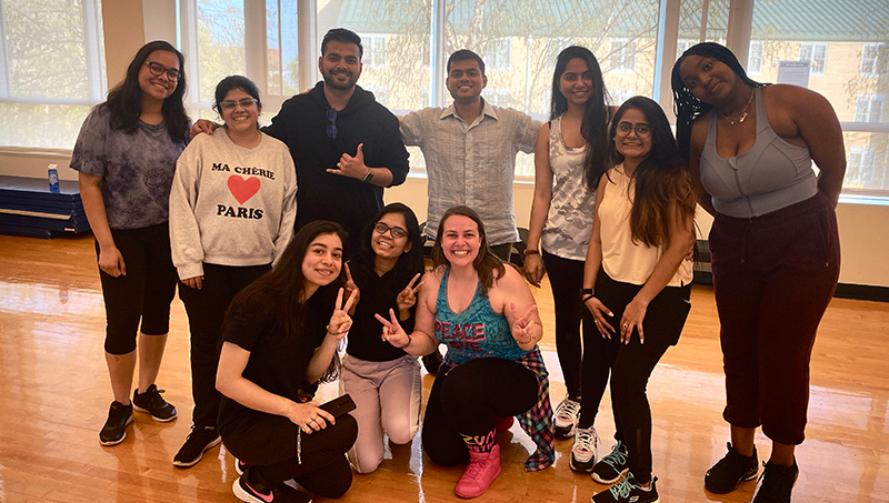 Dorothy Classen (center, with pink sneakers) and students are charged up about Zumba.