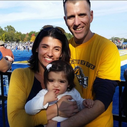 Image of Andrew, Connie, and Madalyn Dinkel at Homecoming in 2014. 