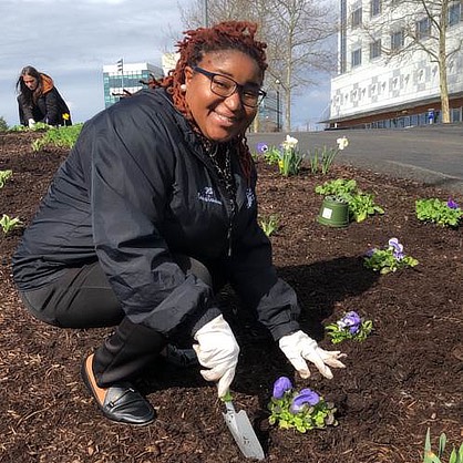 Erica Gardner planting flowers.