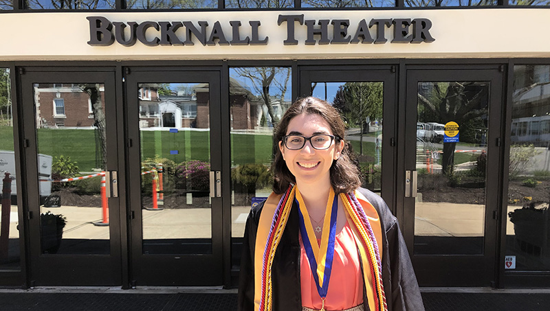 Sydney Guye ’19 in front of Bucknall Hall