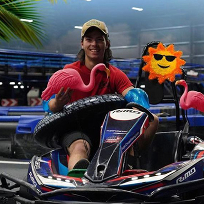 A man riding a go-kart.