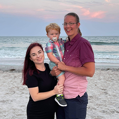 Carrie Robinson smiles side by side with her family.