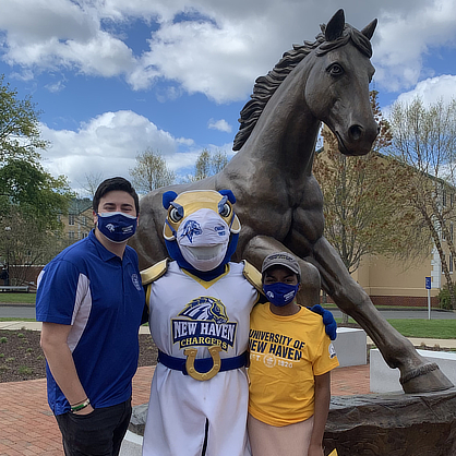 Hannah Providence at the Charger statue