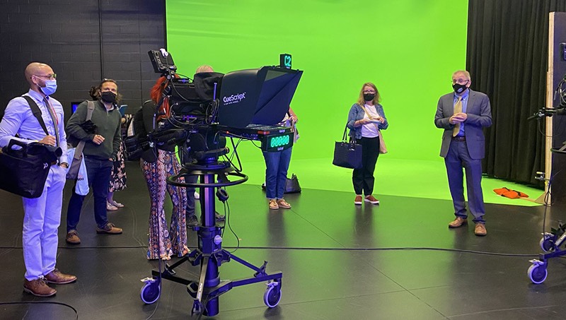 Paul Falcone showing off University's television studio.