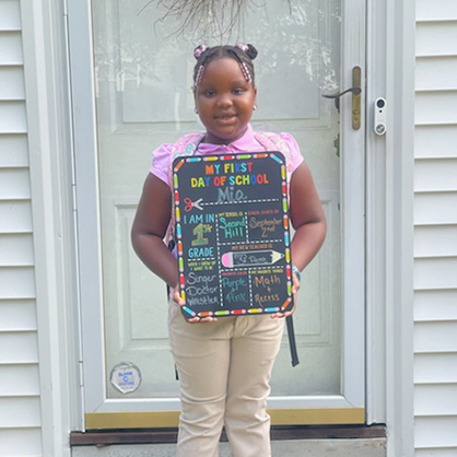 Jim Prosper’s daughter Mia on her front steps.