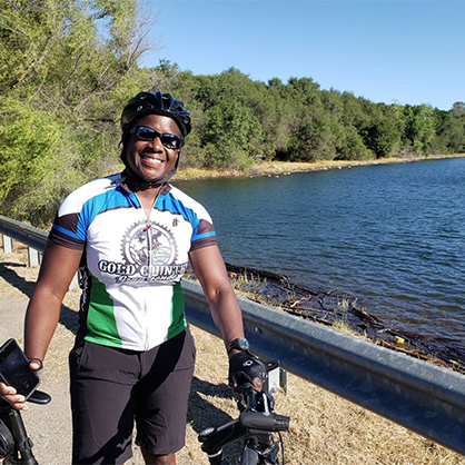 Image of Merryl Tengesdal ’94 riding her bike