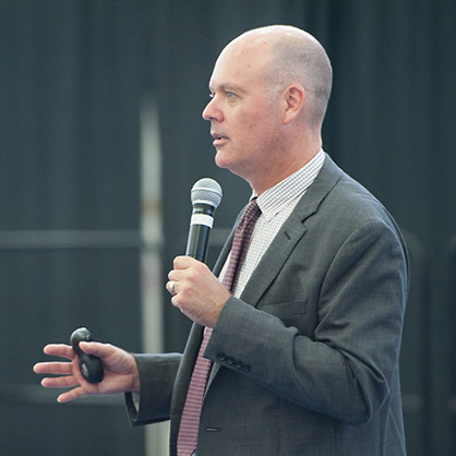 David Schroeder speaking at an event.