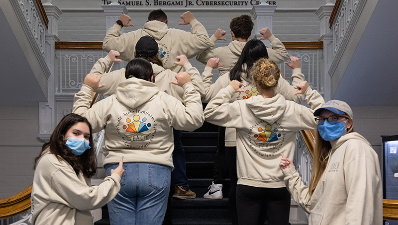 Group image of University of New Haven students promoting T.E.A.C.H.