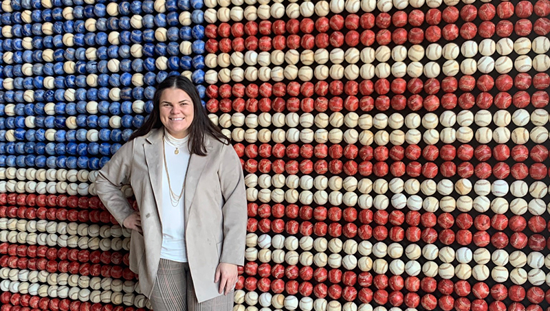 Tess Bloom poses in front of a piece of art at Petco Park.