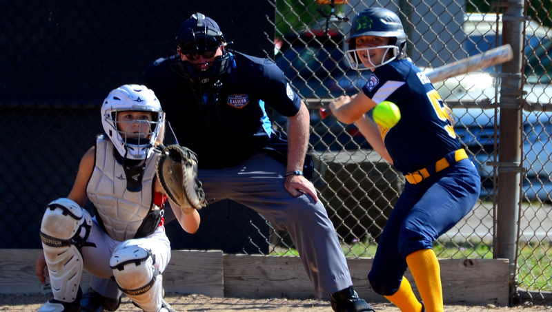 Brian Marks, J.D., Ph.D., officiating a recent Little League softball game in Orange, Conn.