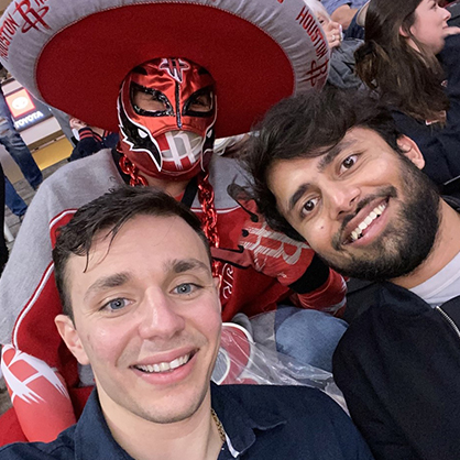 Andreas Xenofontos (left) and Mohammed Anas Ali cheer on the Houston Rockets.