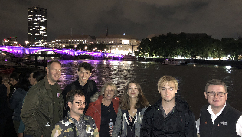 Noah Iott ’25 (back, second from left) and Brennig Johnson ’26 (second from right) with their new friends in London.