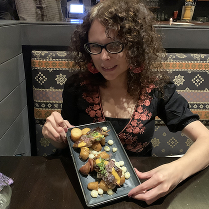 Jennifer Thorndike-Gonzales, Ph.D., with a Peruvian Dish called Anticuchos.