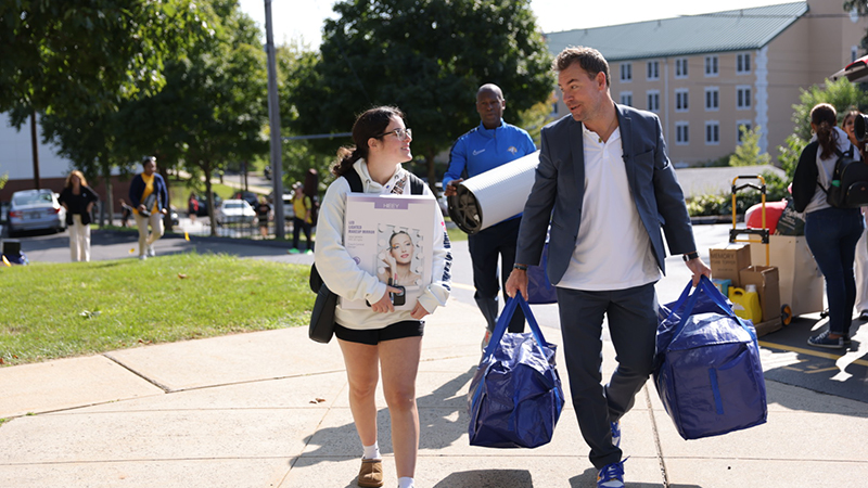 President Jens Frederiksen, Ph.D., was among those greeting the Class of 2028 and their families on move-in day.