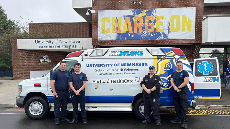 Students in front of the University’s Simbulance. 