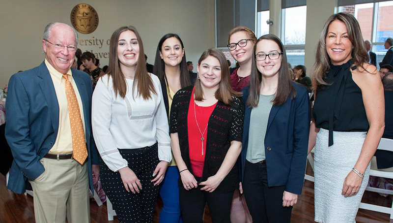 Photo of William Bucknall Jr. ’63, ’65, chair of the Board of Governors, and his daughter, Elise, with recipients of the Bucknall Family STEM Endowed Scholarship