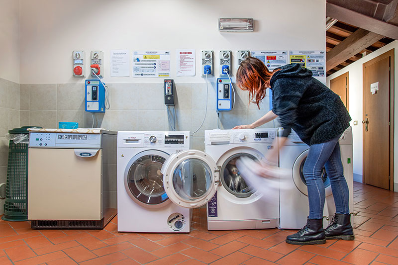 a student doing laundry in Tuscany